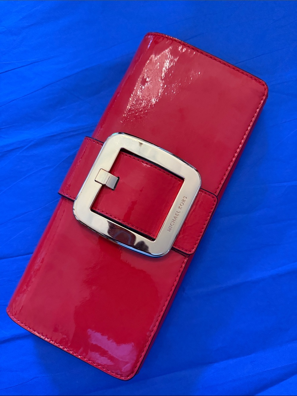 Michael Kors Glossy Orange Patent Leather Clutch with Gold Buckle